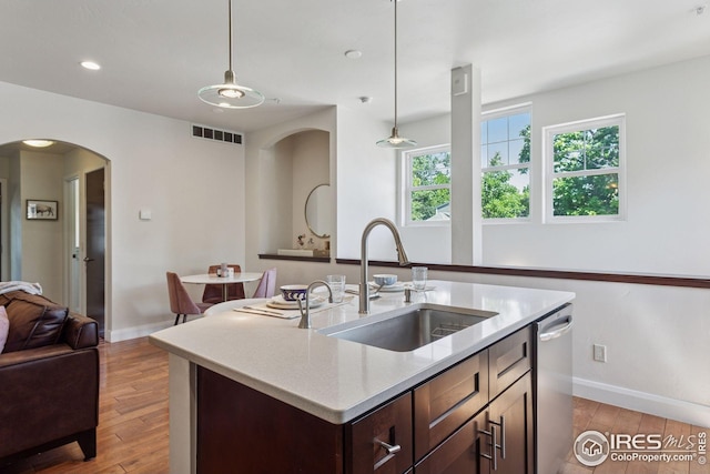 1944 Arapahoe Ave Unit A, Boulder, CO 80302 - kitchen featuring stainless steel dishwasher, light wood finished floors, light countertops, pendant lighting, and recessed lighting