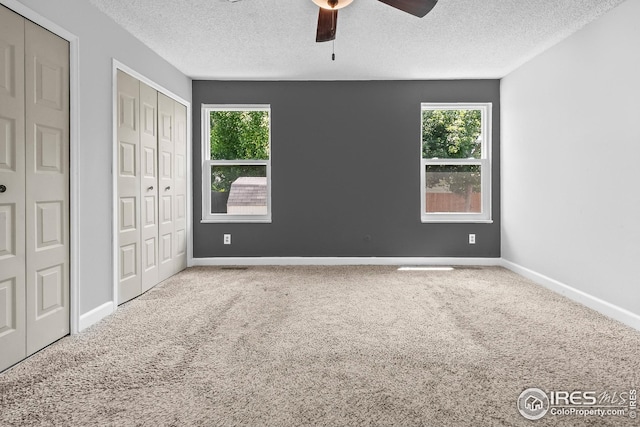 7414 Benton St, Arvada, CO 80003 - unfurnished bedroom featuring carpet flooring, a textured ceiling, and ceiling fan