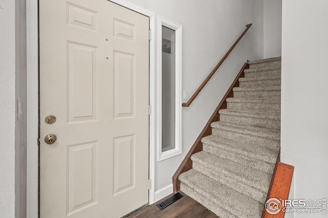 7414 Benton St, Arvada, CO 80003 - stairs with wood finished floors
