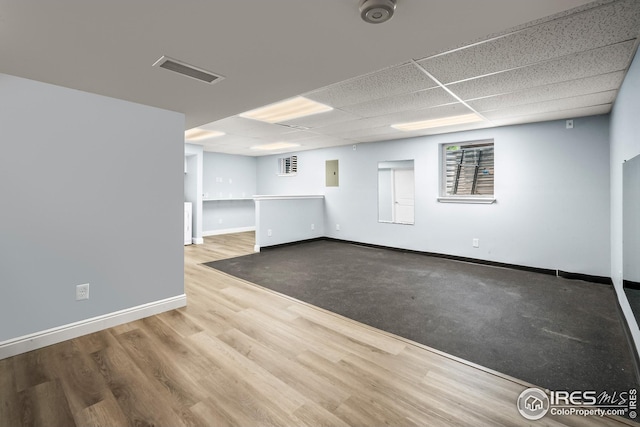 7414 Benton St, Arvada, CO 80003 - spare room with wood finished floors, electric panel, a drop ceiling, and a smoke detector