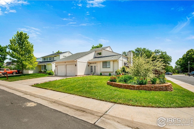 7414 Benton St, Arvada, CO 80003 - view of front of house with concrete driveway, a front yard, a garage, a chimney, and a shingled roof