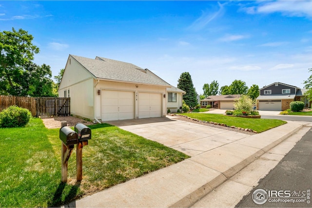 7414 Benton St, Arvada, CO 80003 - view of front facade with roof with shingles, a garage, and concrete driveway