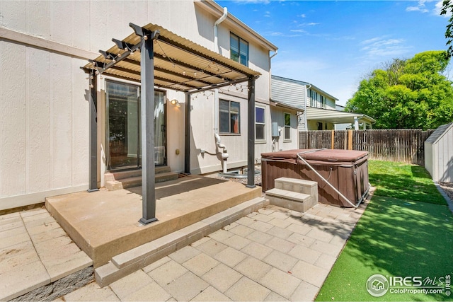 7414 Benton St, Arvada, CO 80003 - fenced backyard with a hot tub, a patio area, and entry steps