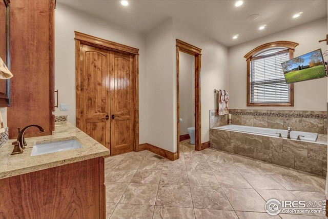 37021 Kingfisher Ct, Severance, CO 80550 - full bathroom with a bath, vanity, and recessed lighting