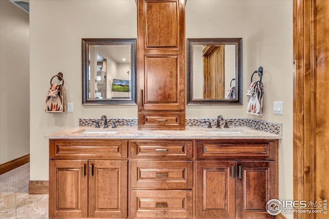 37021 Kingfisher Ct, Severance, CO 80550 - full bath with double vanity and baseboards
