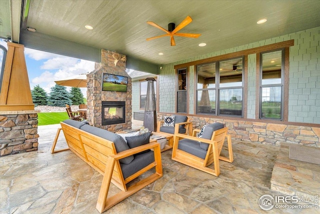 37021 Kingfisher Ct, Severance, CO 80550 - view of patio / terrace featuring an outdoor living space with a fireplace and ceiling fan