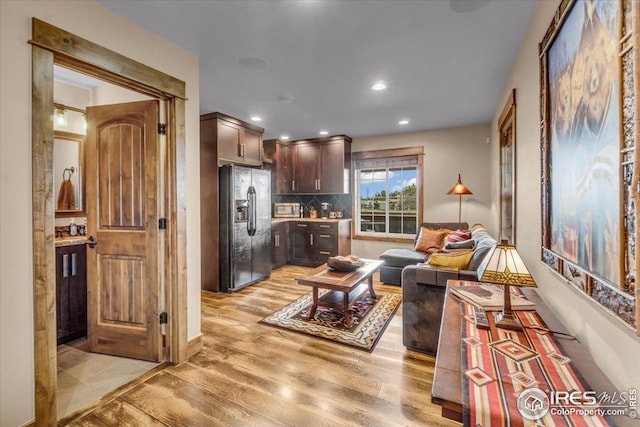 37021 Kingfisher Ct, Severance, CO 80550 - living area featuring light wood finished floors and recessed lighting