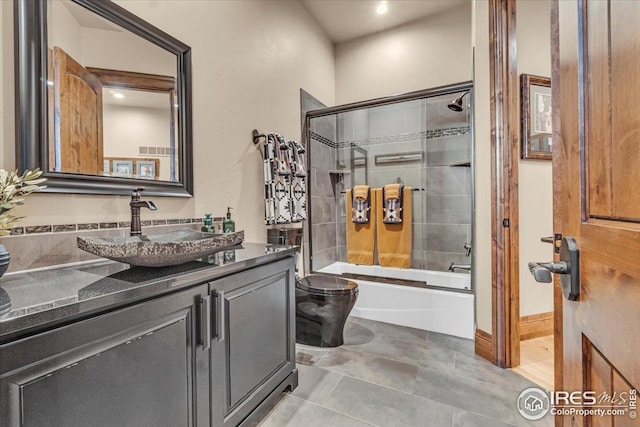 37021 Kingfisher Ct, Severance, CO 80550 - bathroom with vanity and bath / shower combo with glass door