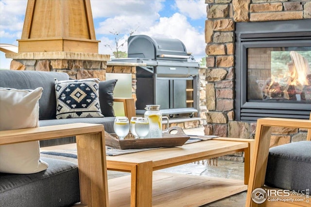 37021 Kingfisher Ct, Severance, CO 80550 - view of patio with a multi sided fireplace and area for grilling