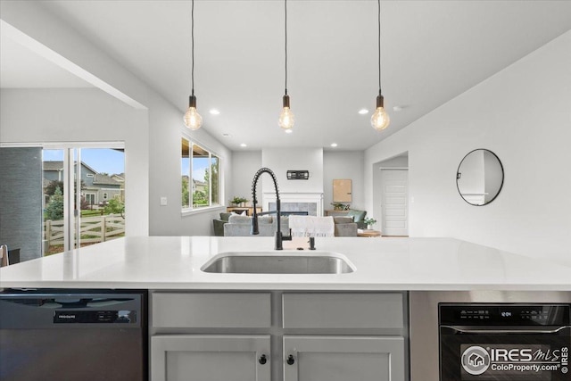 415 Stout St, Fort Collins, CO 80524 - kitchen featuring dishwasher, dishwashing machine, a fireplace, light countertops, and recessed lighting
