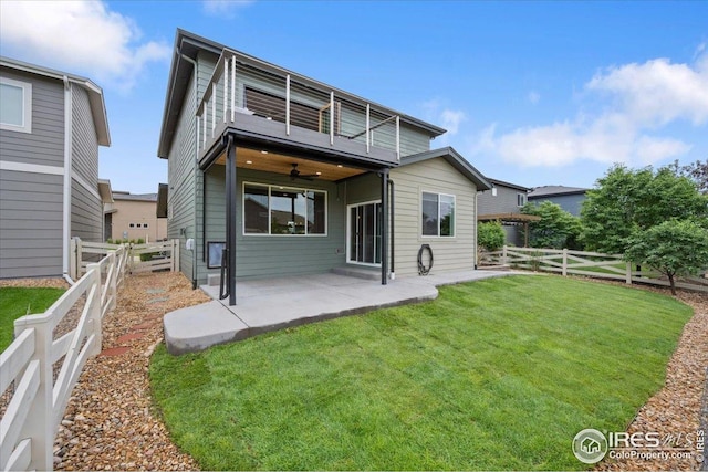 415 Stout St, Fort Collins, CO 80524 - back of house with a balcony, ceiling fan, a patio, and a fenced backyard