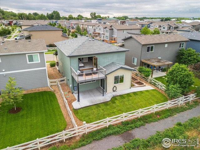415 Stout St, Fort Collins, CO 80524 - back of property featuring a residential view, a patio, and a fenced backyard