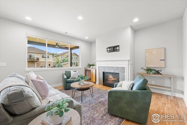 415 Stout St, Fort Collins, CO 80524 - living area featuring wood finished floors, recessed lighting, and a tiled fireplace