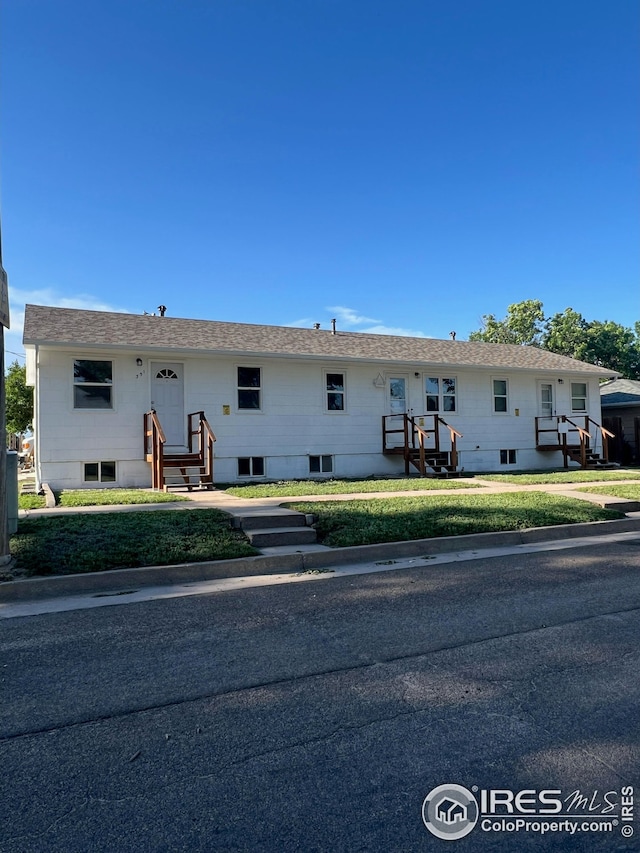 351 E 2nd St, Akron, CO 80720 - view of front facade with a front lawn
