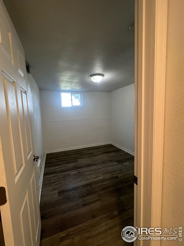 351 E 2nd St, Akron, CO 80720 - unfurnished room with dark wood-style flooring and baseboards