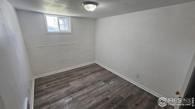 351 E 2nd St, Akron, CO 80720 - basement featuring dark wood-type flooring