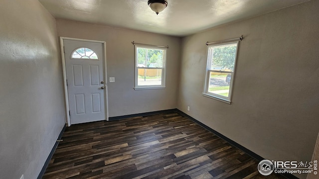 351 E 2nd St, Akron, CO 80720 - entrance foyer with healthy amount of natural light and dark wood-type flooring