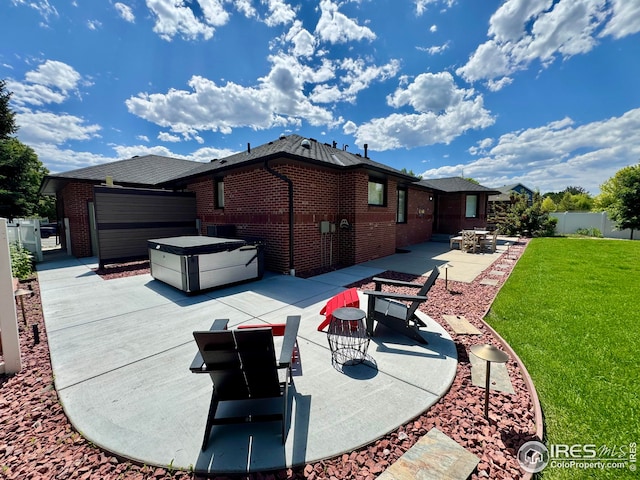 1806 Crestone Ct, Longmont, CO 80504 - rear view of house featuring a patio, brick siding, and an attached garage
