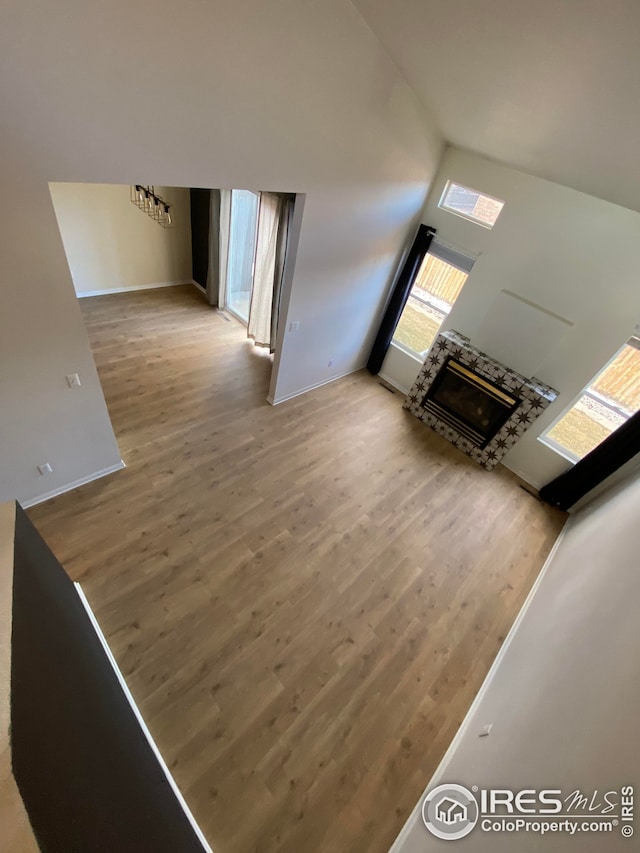 723 2nd St, Windsor, CO 80550 - living area with wood finished floors, a fireplace, and vaulted ceiling