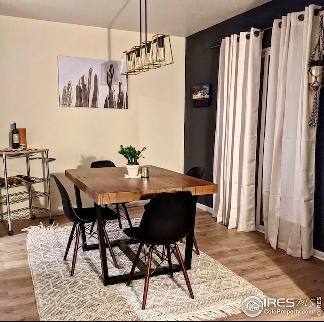 723 2nd St, Windsor, CO 80550 - dining room featuring light wood finished floors and baseboards