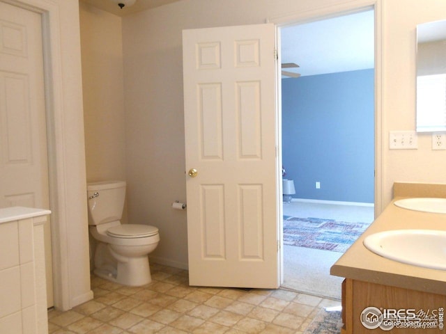 12609 Jersey Cir W, Thornton, CO 80602 - bathroom featuring double vanity and toilet