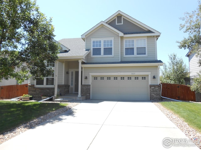12609 Jersey Cir W, Thornton, CO 80602 - craftsman-style home with brick siding, driveway, and an attached garage