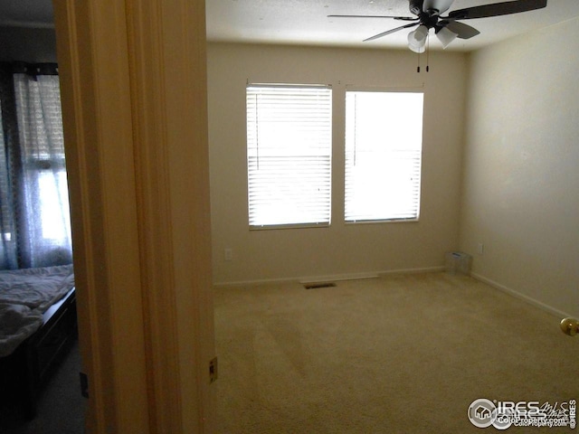 12609 Jersey Cir W, Thornton, CO 80602 - spare room with ceiling fan and carpet floors