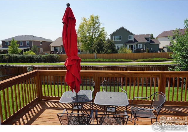 12609 Jersey Cir W, Thornton, CO 80602 - deck featuring a residential view, a fenced backyard, and outdoor dining space