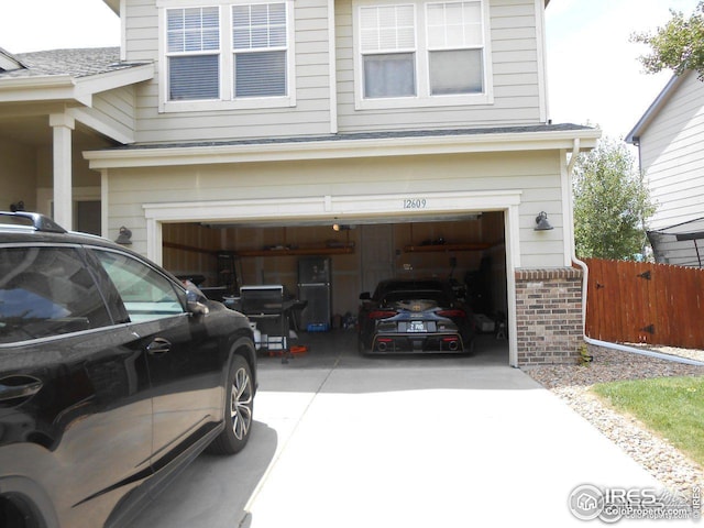 12609 Jersey Cir W, Thornton, CO 80602 - garage with concrete driveway