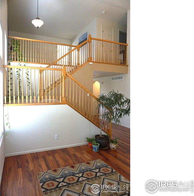 12609 Jersey Cir W, Thornton, CO 80602 - stairway with wood finished floors and baseboards