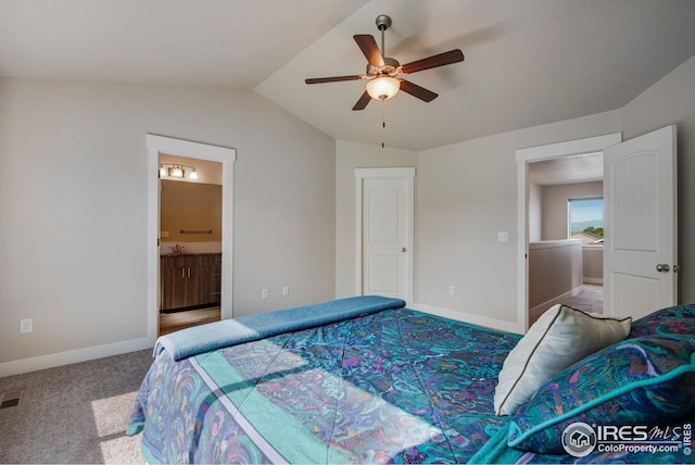 108 Wake St, Frederick, CO 80530 - carpeted bedroom with vaulted ceiling, connected bathroom, and a ceiling fan