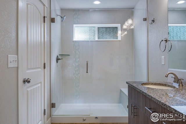 108 Wake St, Frederick, CO 80530 - full bathroom with a stall shower, vanity, and recessed lighting