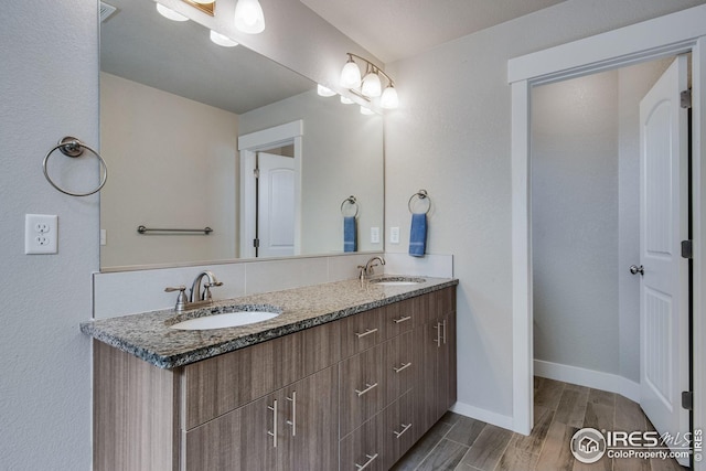108 Wake St, Frederick, CO 80530 - bathroom featuring wood finished floors and double vanity