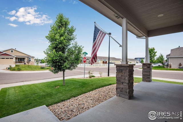 108 Wake St, Frederick, CO 80530 - covered porch featuring a yard
