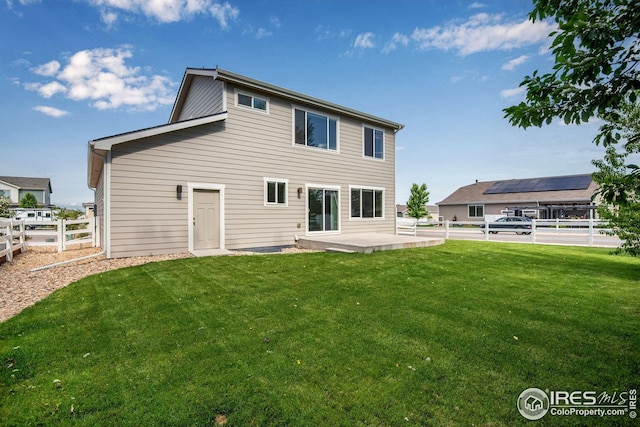 108 Wake St, Frederick, CO 80530 - back of property featuring a patio area and a fenced backyard
