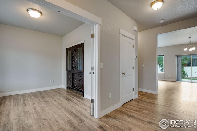108 Wake St, Frederick, CO 80530 - entryway featuring wood finished floors and a chandelier