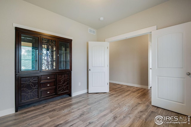 108 Wake St, Frederick, CO 80530 - unfurnished bedroom with wood finished floors and baseboards