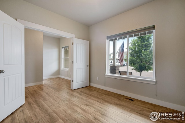 108 Wake St, Frederick, CO 80530 - spare room featuring wood finished floors and baseboards