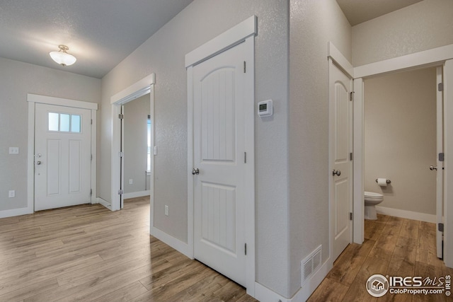 108 Wake St, Frederick, CO 80530 - entrance foyer with light wood-style flooring and a textured wall