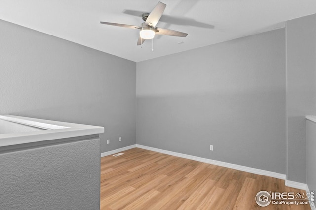 14300 Waterside Ln Unit E3, Broomfield, CO 80023 - unfurnished room featuring wood finished floors and a ceiling fan