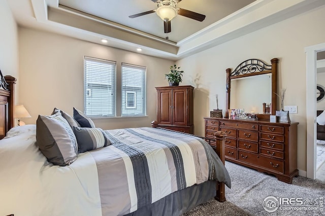 7840 Cattail Grn, Frederick, CO 80530 - bedroom featuring carpet, a tray ceiling, and a ceiling fan