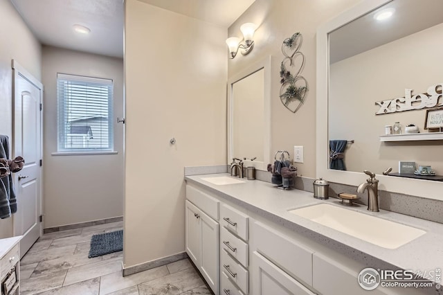 7840 Cattail Grn, Frederick, CO 80530 - full bathroom featuring double vanity and baseboards