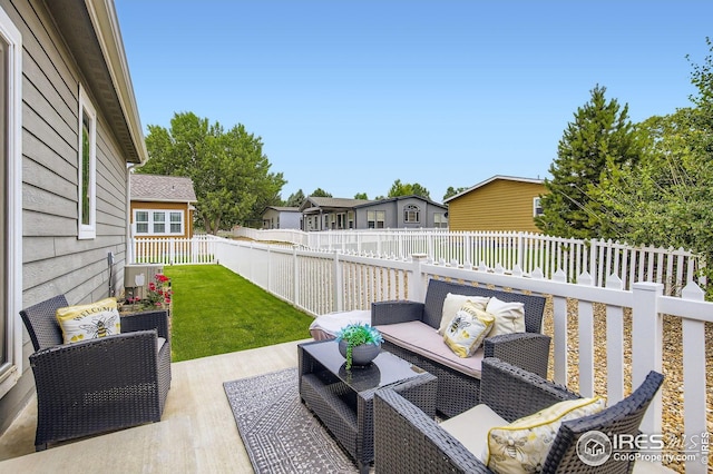 7840 Cattail Grn, Frederick, CO 80530 - fenced backyard featuring an outdoor hangout area, a residential view, and a deck