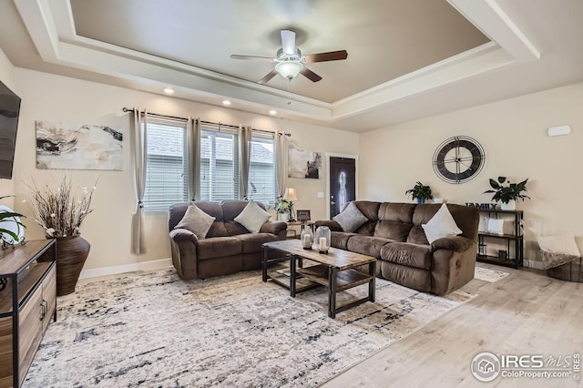 7840 Cattail Grn, Frederick, CO 80530 - living room with a tray ceiling, a ceiling fan, recessed lighting, and wood finished floors