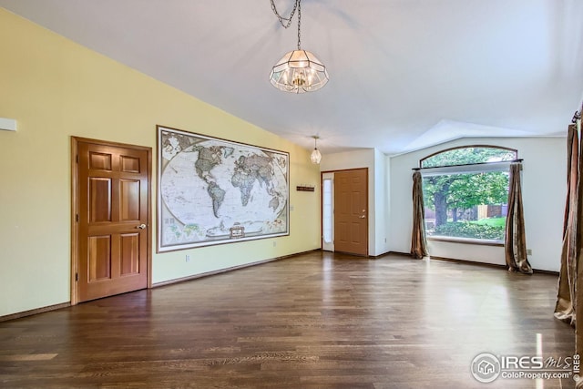 10947 W 100th Dr, Westminster, CO 80021 - entrance foyer with lofted ceiling, a chandelier, and dark wood-type flooring
