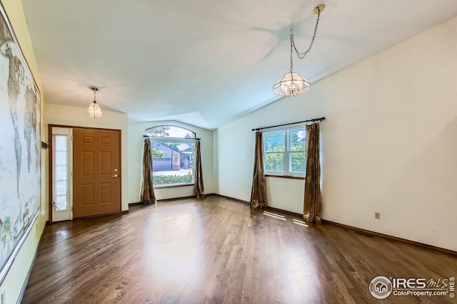 10947 W 100th Dr, Westminster, CO 80021 - foyer with healthy amount of natural light, lofted ceiling, wood finished floors, and a chandelier