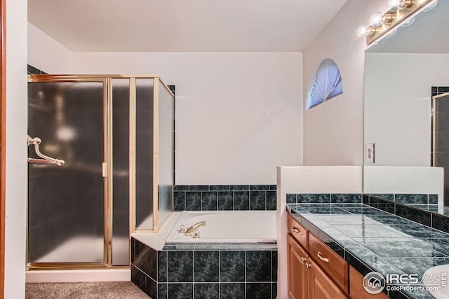 10947 W 100th Dr, Westminster, CO 80021 - bathroom with vanity, a shower stall, and a garden tub