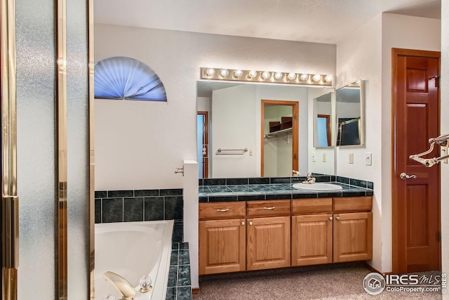 10947 W 100th Dr, Westminster, CO 80021 - full bathroom featuring vanity and a garden tub