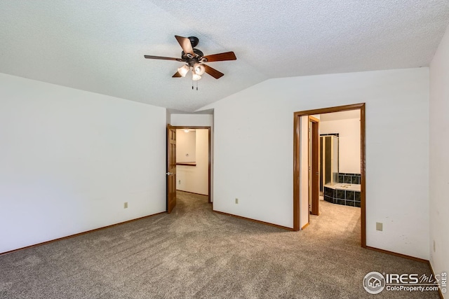 10947 W 100th Dr, Westminster, CO 80021 - unfurnished room featuring ceiling fan, carpet flooring, lofted ceiling, and a textured ceiling