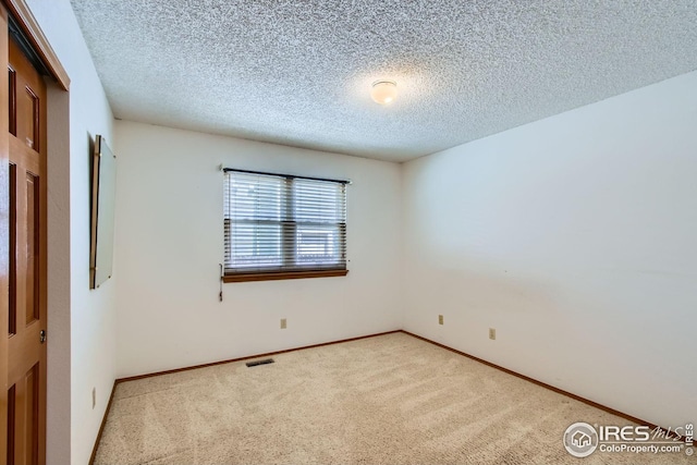 10947 W 100th Dr, Westminster, CO 80021 - carpeted empty room featuring a textured ceiling and baseboards